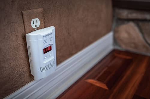 A carbon monoxide detector plugged into an outlet
