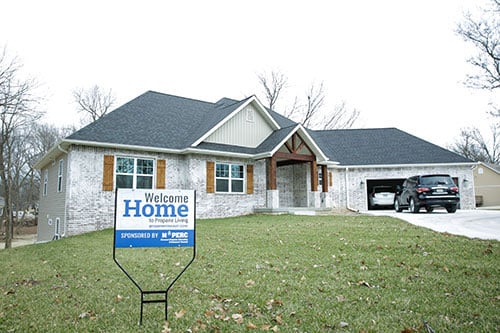 Joplin Propane Home exterior with a 'Welcome Home to Propane Living' yard sign in the front lawn 