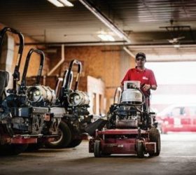 Man riding on propane mower