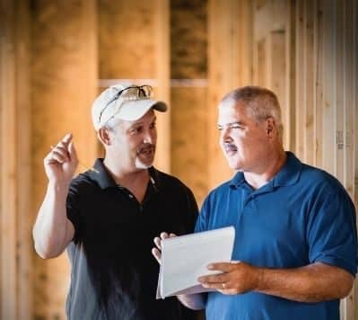Homebuilder talking with a man