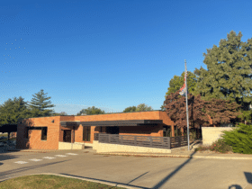 Image of the outside of building with flag