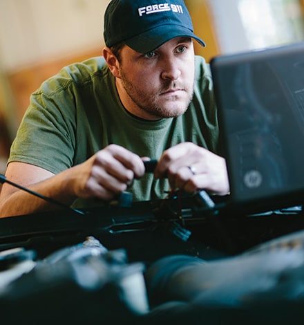 Propane Autogas Technician Servicing a Vehicle