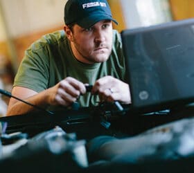 A propane autogas technician reviewing information on a computer