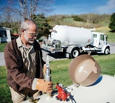 Technician testing propane tank